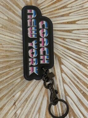 Coach Black Logo Keychain with Blue-Pink Gradient Lettering